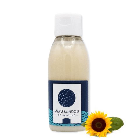 100-ml-Flasche mit dem Sonnenblumen-Waschgel von wasserundoel und kleiner Sonnenblume im Vordergrund